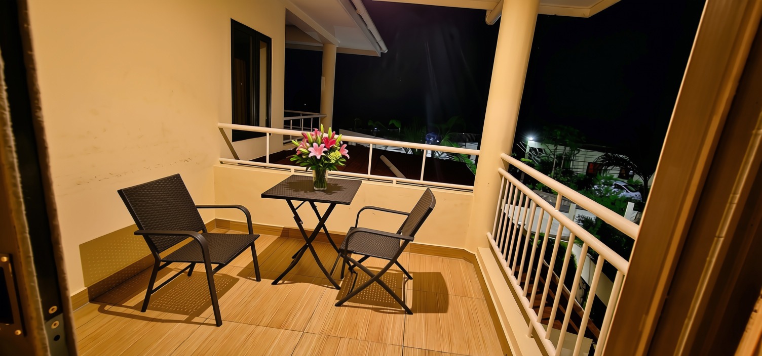 Private balcony off Room 102 — evening views