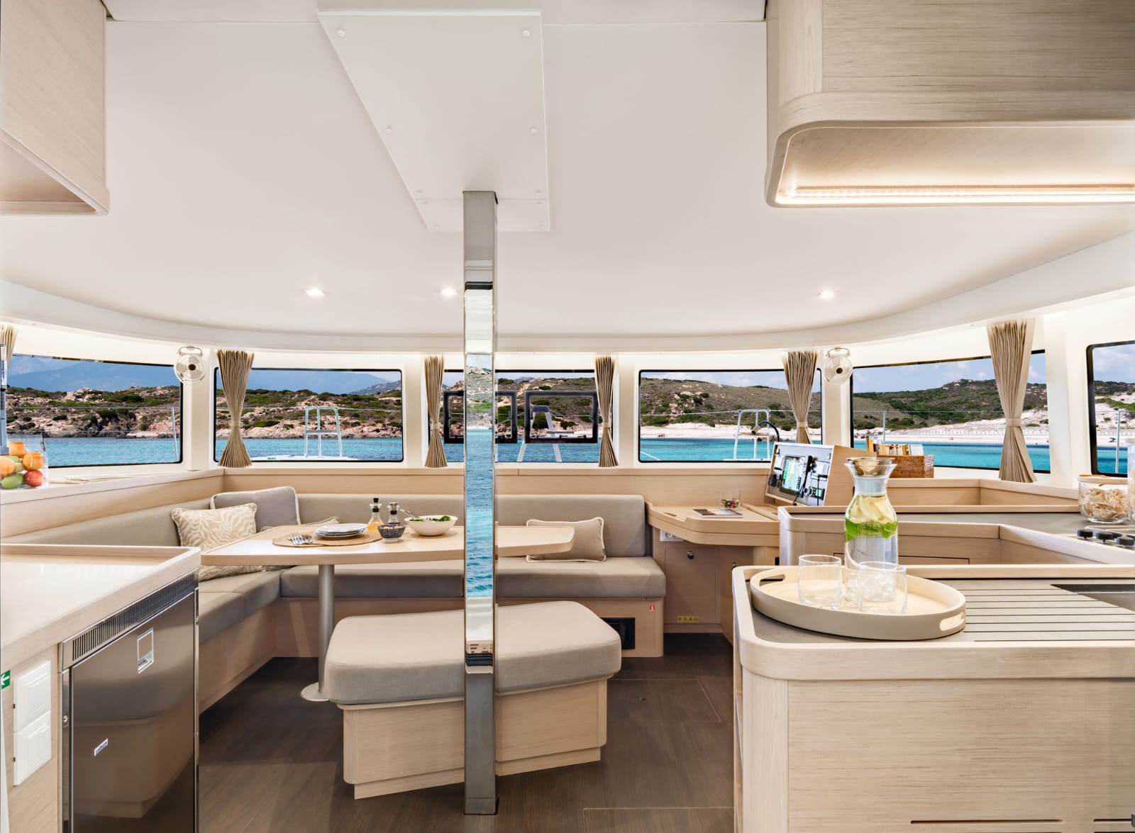 Spacious catamaran lounge with panoramic windows