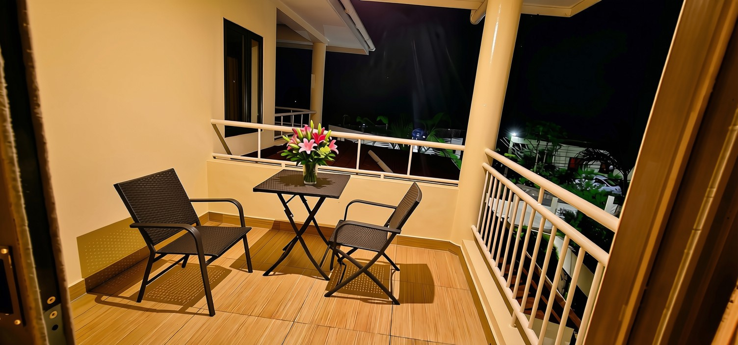 Room 102 private balcony — evening seating for two