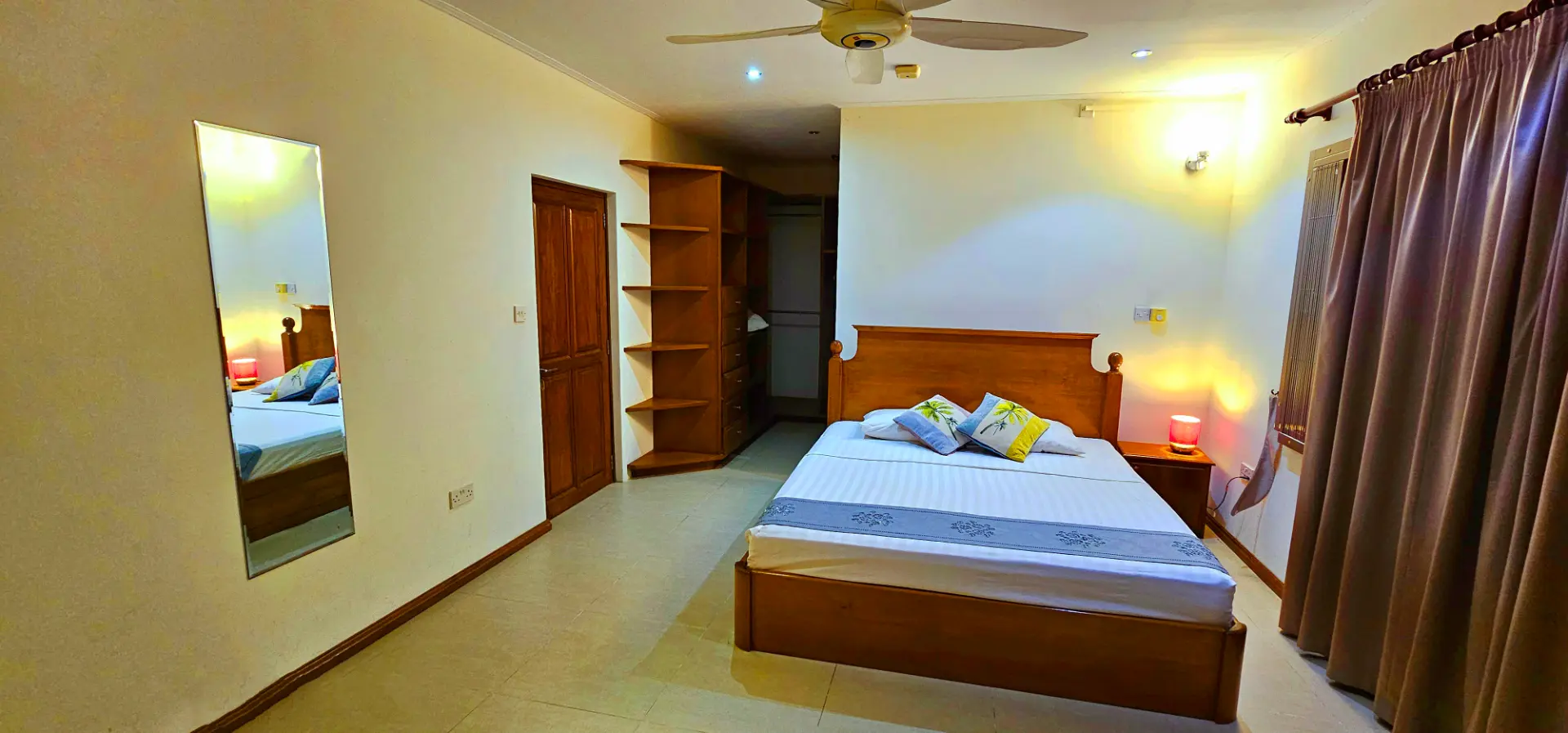 Room 104 — king bed, full-length mirror & walk-in wardrobe